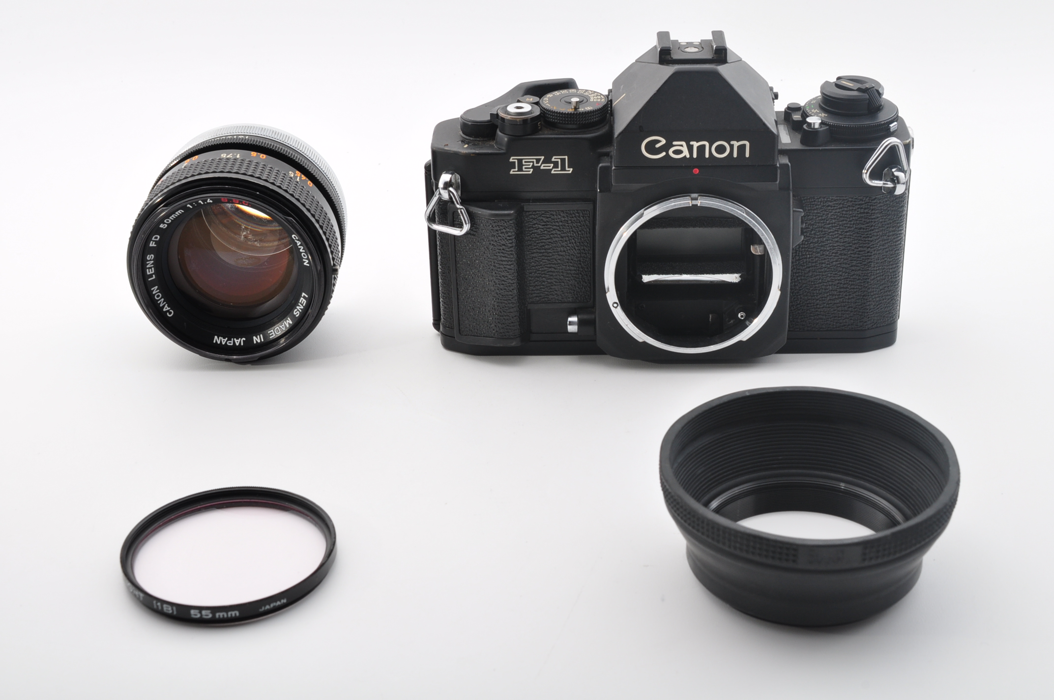 Camera, lens, lens hood and 55mm skylight filter — actual item
